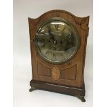 A Regency mahogany inlaid bracket clock with a bra