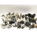 A collection of over 25 Cheval ceramic horses.