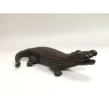 A cast iron inkwell in the form of a crocodile ins