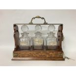 Betjemannas Tantalus with decanters & hallmarked s