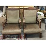 A pair of solid Edwardian walnut open arm chairs.on square legs
