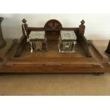 A walnut desk stand inset with glass inkwells, tog