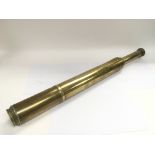 A vintage Negretti & Zambra brass telescope.