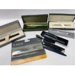 A collection of various pens including Parker, Cro