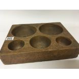 A carved oak coin tray with five compartments 35x2