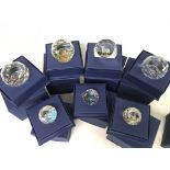 A collection of boxed Swarovski including VE Day paperweight, Golden Jubilee of H.M Queen