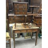 A small mahogany side table fitted with three drawers a two tier stand and a mahogany table the twin