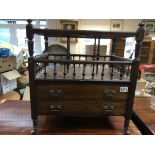 A late Victorian Canterbury walnut and rosewood. With turned open supports above two drawers.