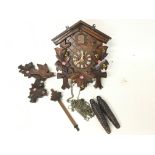 Black Forest German cuckoo clock with a floral des