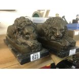 A pair bronze figures in the form of lions on marb