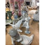 A collection of figures including Lladro.
