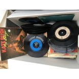 A box of 7inch singles by various artists from the