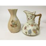 A Royal Worcester porcelain jug decorated with flo