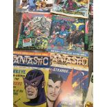 A collection of 1960s and 70s comics including fan