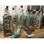 A collection of glass ships in the bottles .