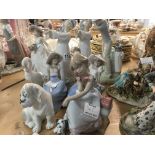 A collection of figures including Lladro Nao , and others.