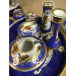 A Noritake dressing table set decorated with a lan