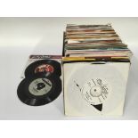 A box of 7inch singles by various artists from the
