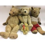 Four vintage teddy bears.