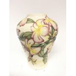 A Moorcroft trial vase dated 21-11-00 tube lined with flowers. No obvious damage height 22cm