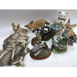 Assorted wildlife figurines and some China plate a