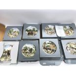 A collection of Wedgwood plates in there boxes.