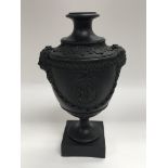 A Neale or Hanley black basalt urn with classical