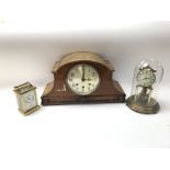 Clocks consisting of a brass Kundo clock with a glass dome, a Wellington repeater clock & a mantel