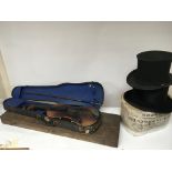 A Vintage top hat a folding top hat a cased violin