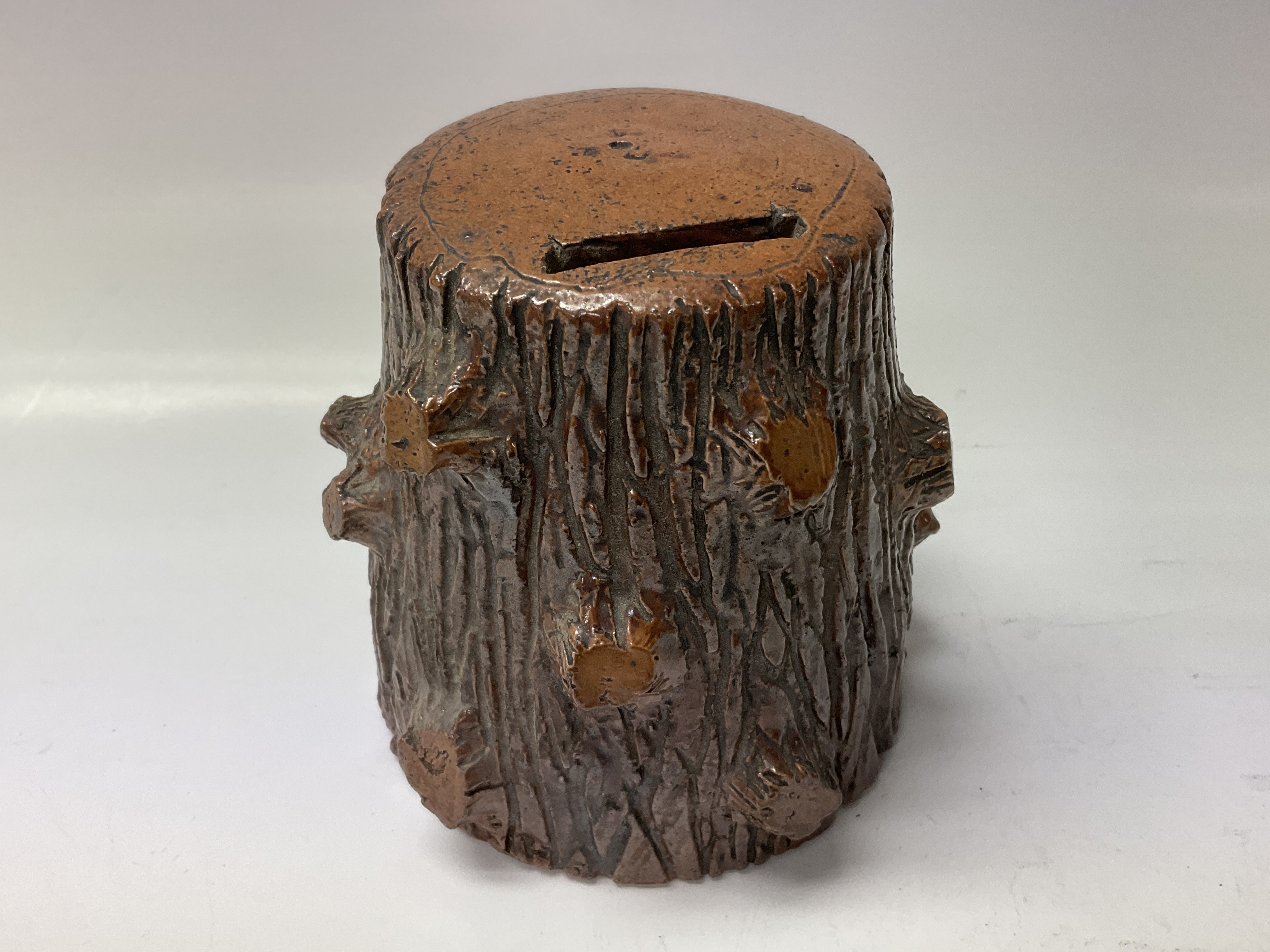 Withdrawn- A Leigh pottery money box in the form of a tree tr