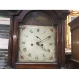 A oak 8 day long case clock the painted dial with