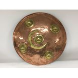 A Persian inspired copper and brass sheild.