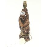 A carved hardwood oriental sage figure converted t