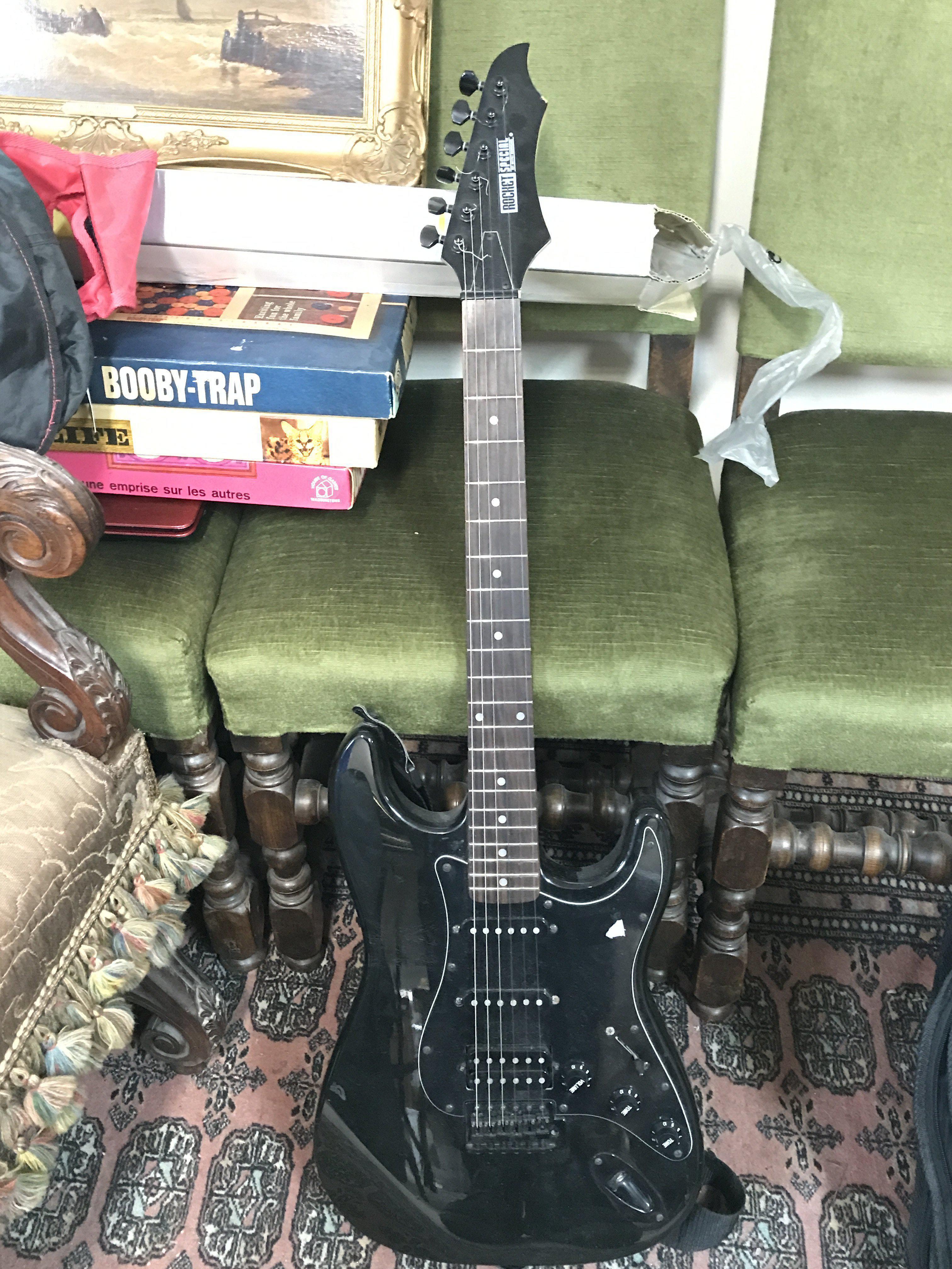 Rocket special Stratocaster copy electric guitar with a black finish and hardware. Comes with a