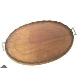 An Edwardian inlaid mahogany oval butlers tray. 64