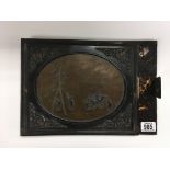 A decorative book or photograph album cover depicting Oriental figures in a landscape setting,