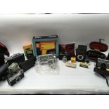Vintage camera equipment and accessories including a boxed Super 8 movie camera and The Polaroid