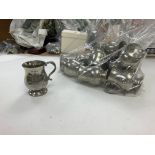 A bag of mini pewter jugs and a large silver jug.