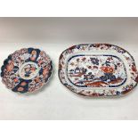 A stoneware plate and a Japanese plate.