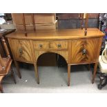 An inlaid mahogany sideboard fitted with two cupbo