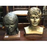 A pair of composite busts of women.