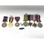 World War 2 medals and pins including French and British medals.