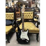 Fender squire Stratocaster electric guitar in a black finish with a soft case