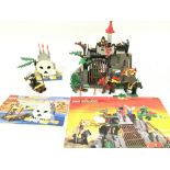 A Lego Castle Knights Dragon Den #6076 and Pirates Volcano #6248 both with Instructions.(2).