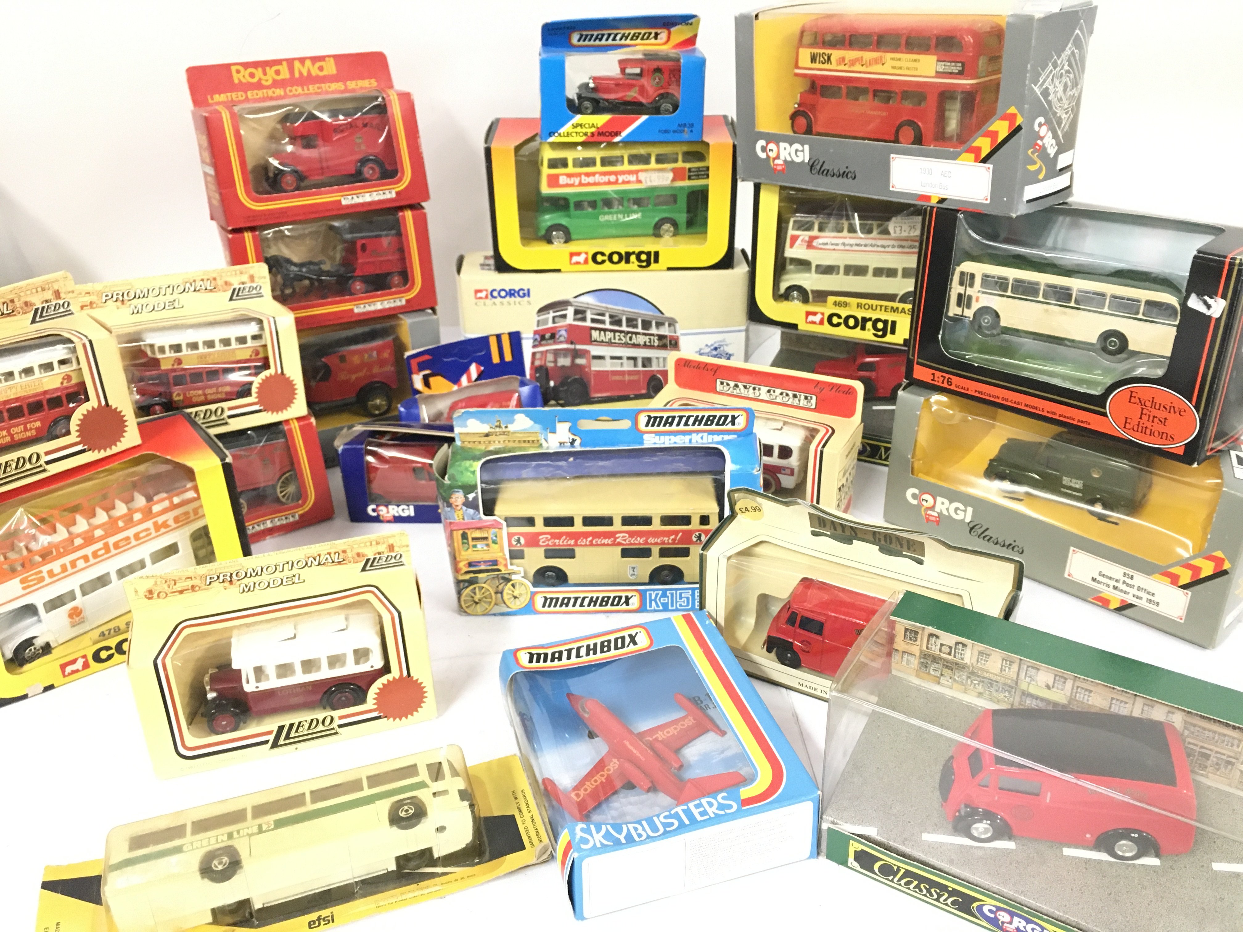 A Collection of Boxed Die-Cast Buses and Vans etc.