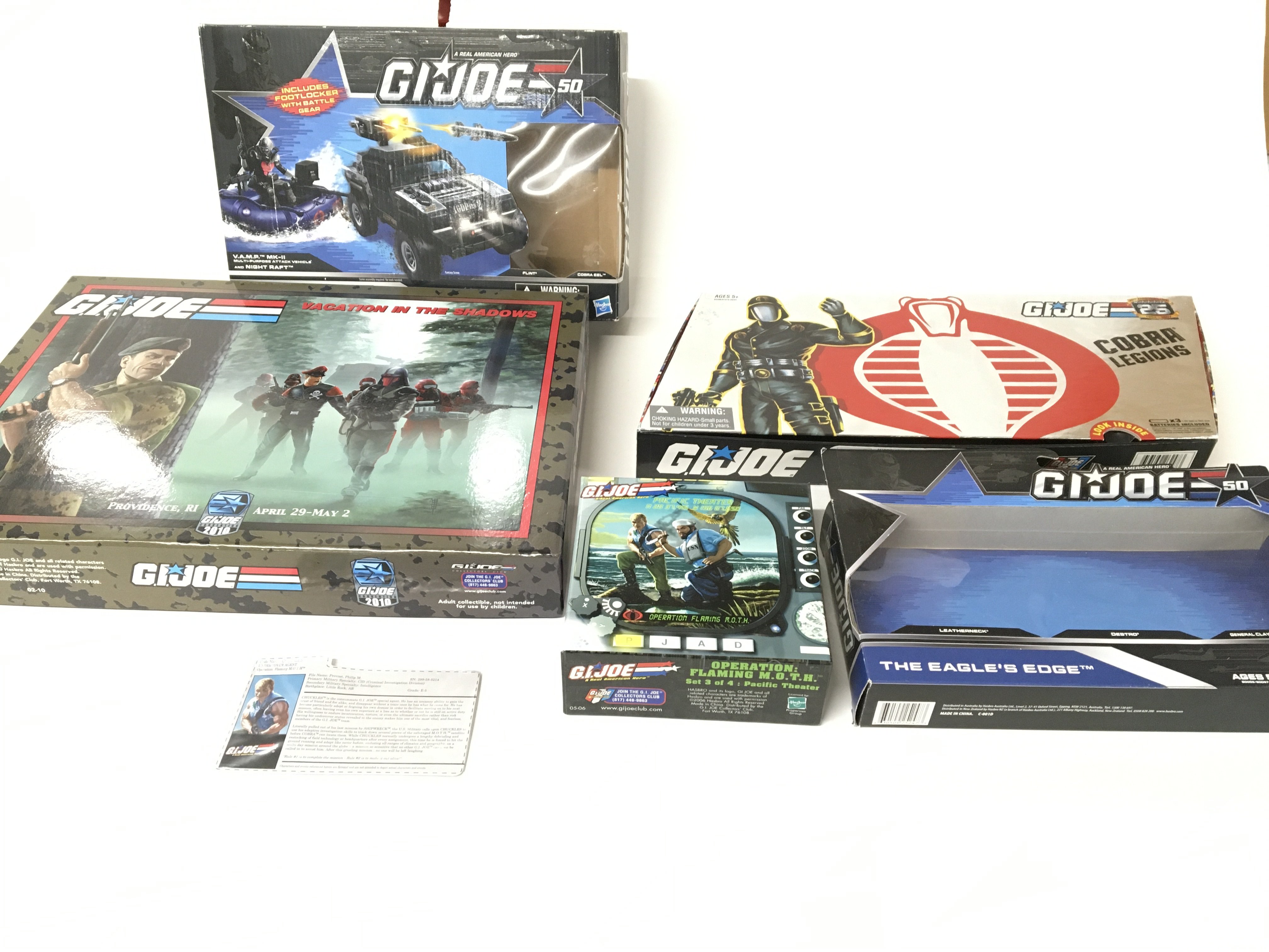 A collection of various empty G I Joe boxes.