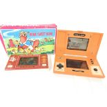 A Nintendo Game and Watch Donkey Kong and a Boxed