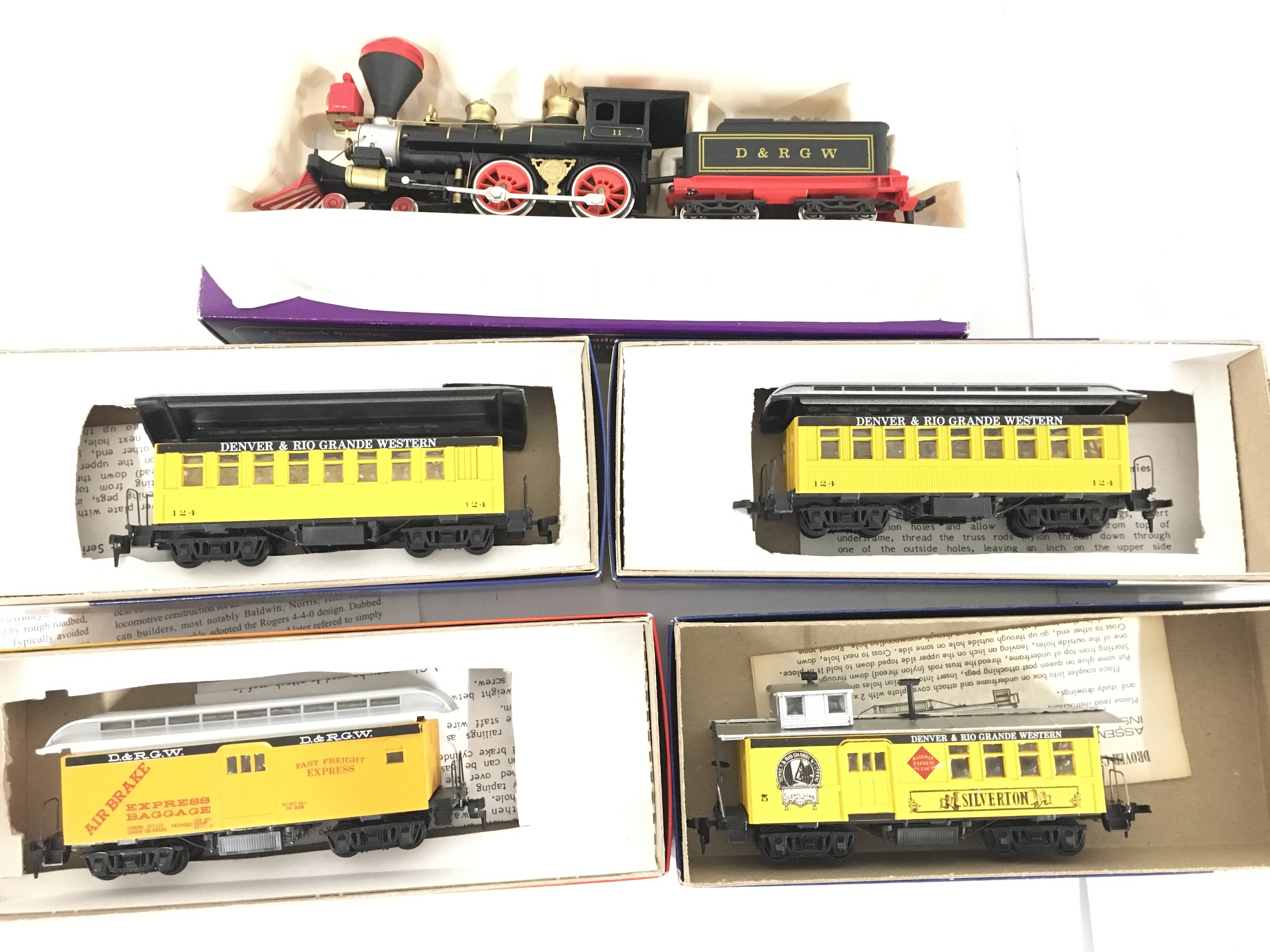 A Boxed HO Gauge Old Timer 4-4-0 and 4 x Coaches