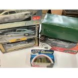 A Box Containing Various Boxed Aston Martins. Incl