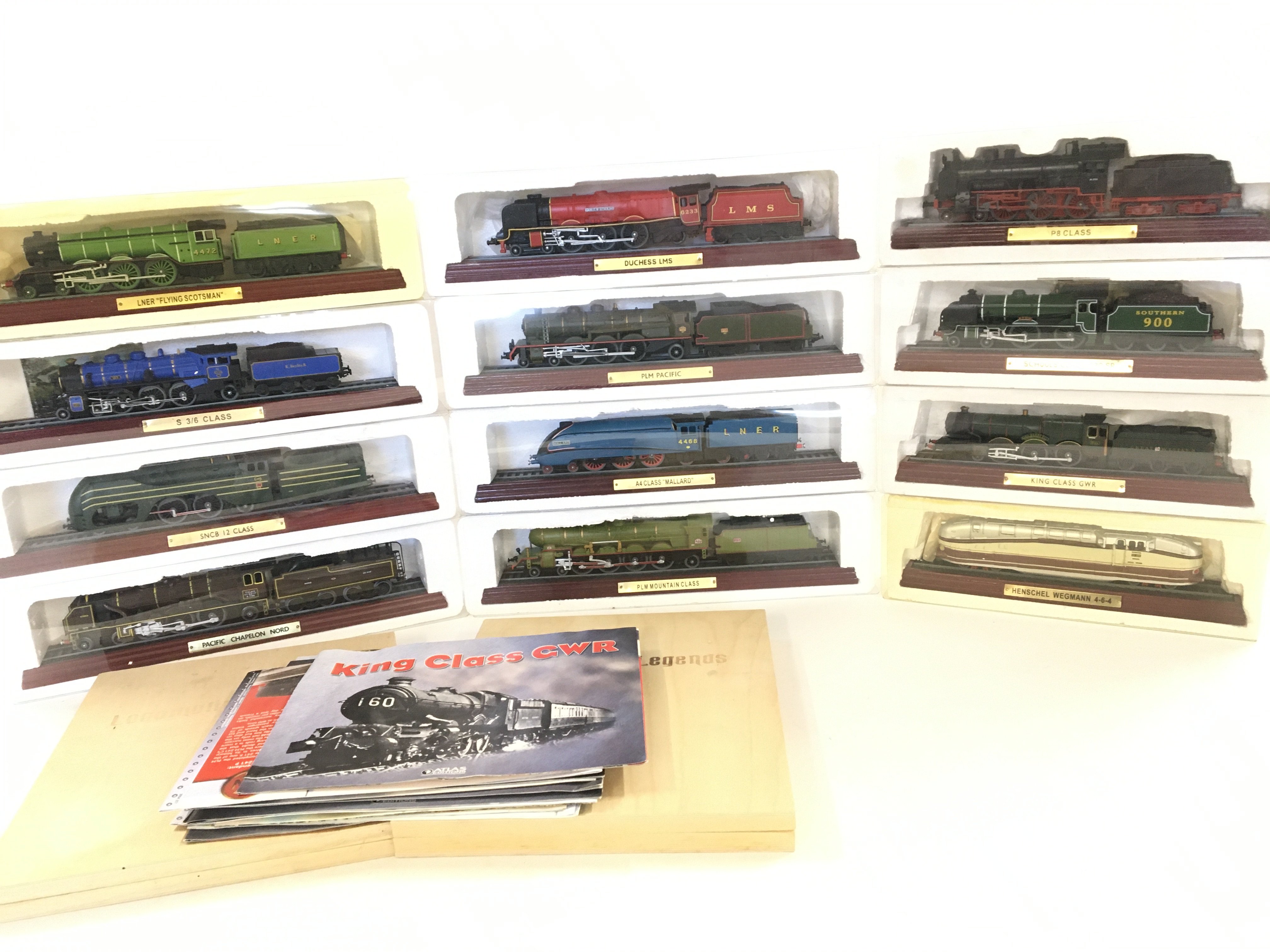 A Box Containing Atlas Editions model Trains.